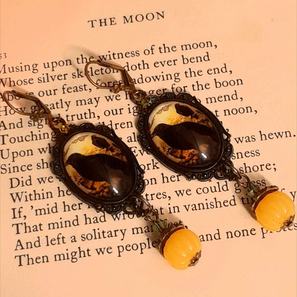 Witchy crow earrings featuring dark birds, autumn woodland imagery, yellow cabochons, rounded pumpkin drops, and sparkling Swarovski crystals, Victorian style and vintage style fantasy jewelry by Rachel Flam Design