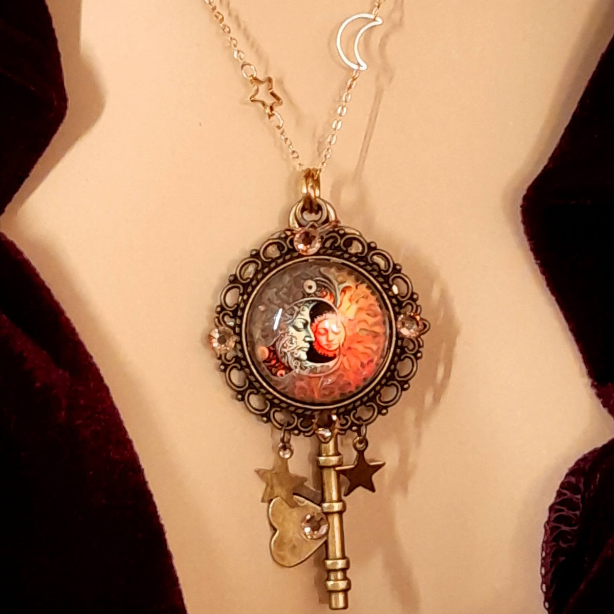 bohemian sun and moon cabochon necklace with stars and gold chain with stars and moons