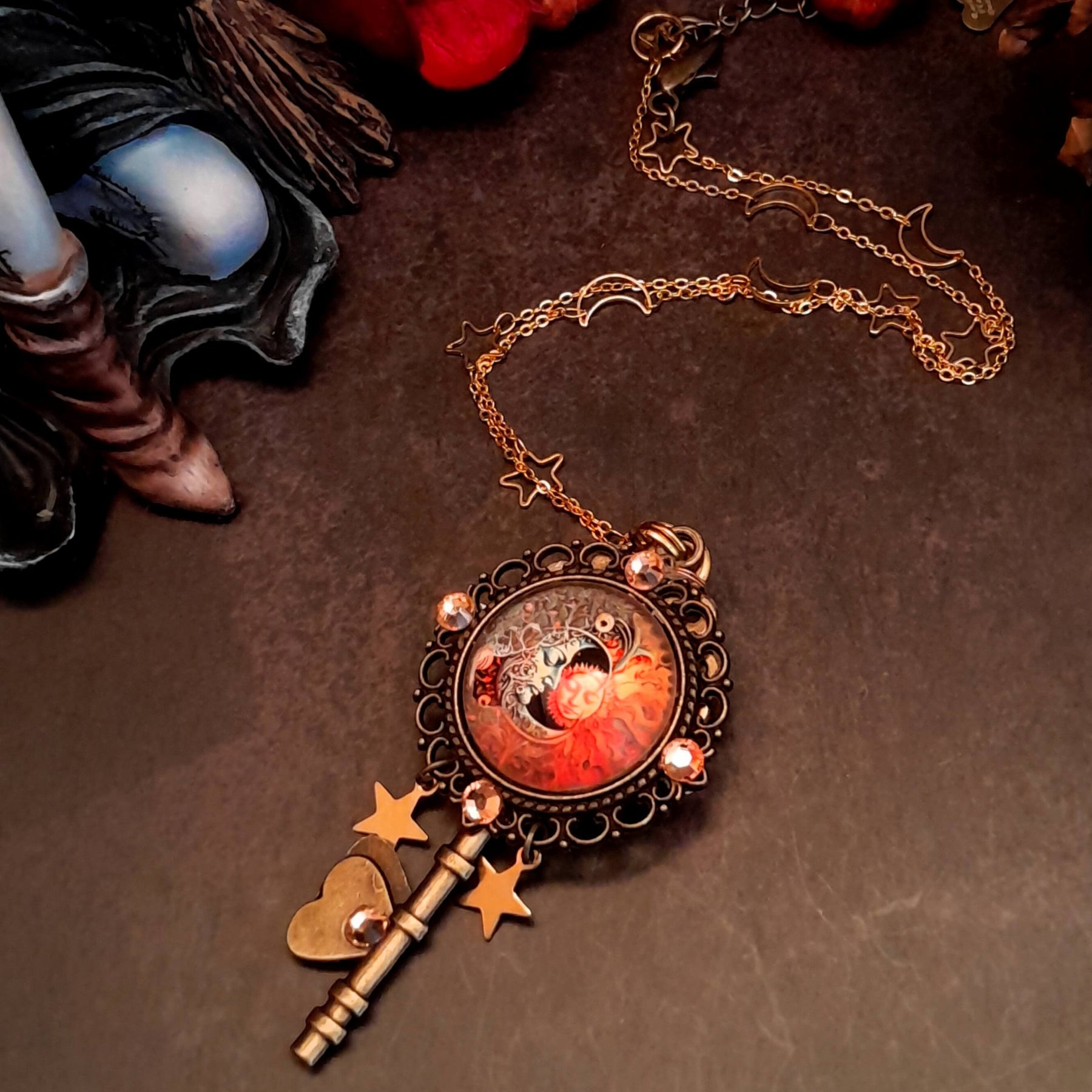 bohemian sun and moon cabochon necklace with stars and gold chain with stars and moons