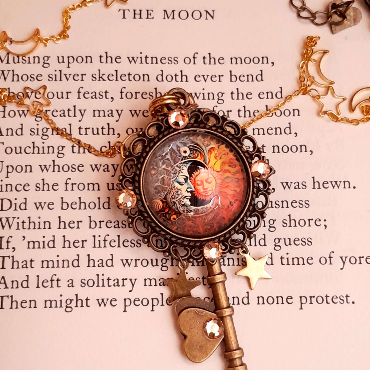 bohemian sun and moon cabochon necklace with stars and gold chain with stars and moons