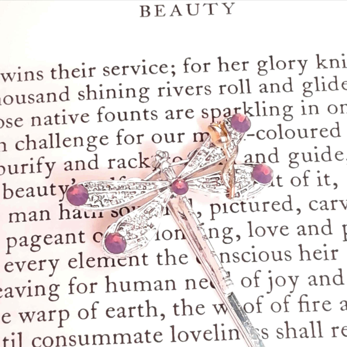 dragonfly hairclip with swarovski amethyst opal purple crystals and a small flower accent