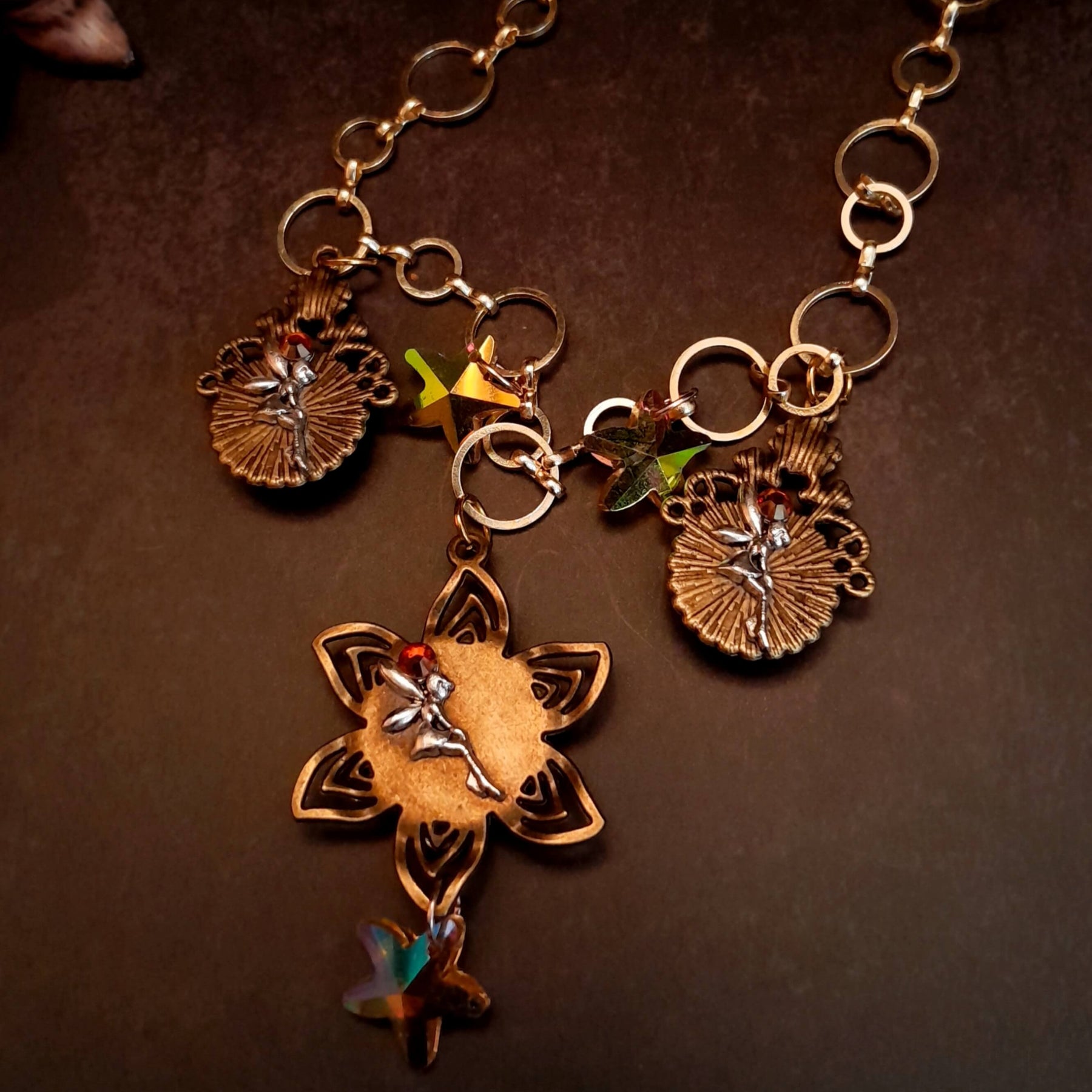 owl necklace with yellow star crystals and yellow brown tones floral settings for owl cabochons