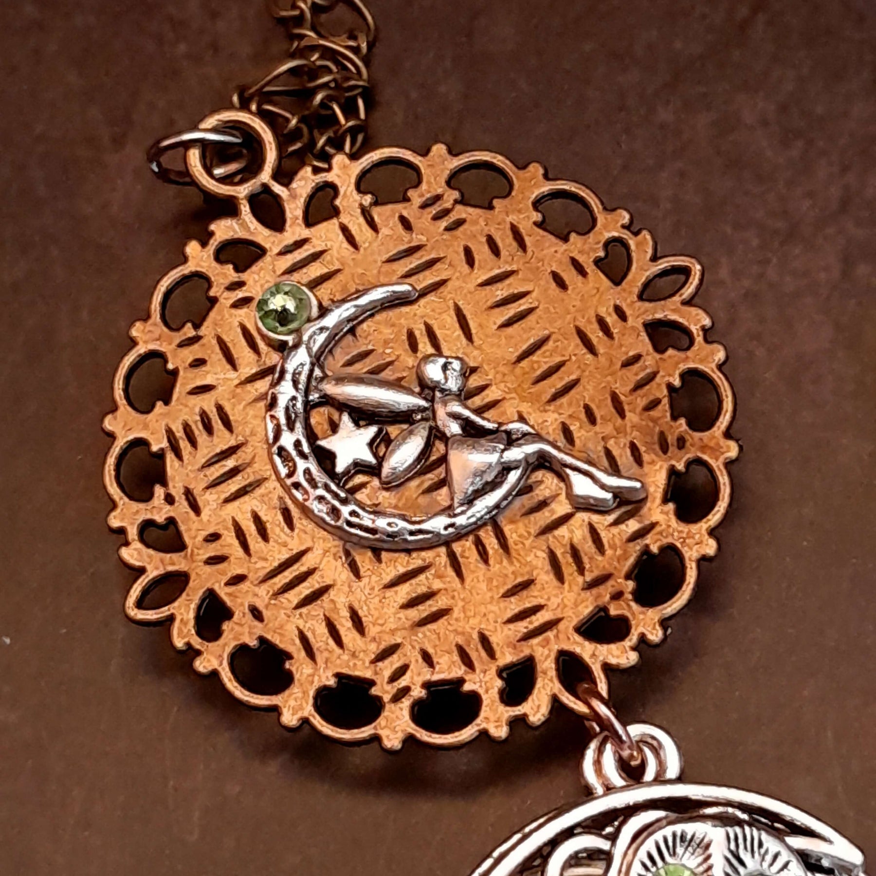 Moon sun cabochon necklace with a double sided owl and green swarovski crystals