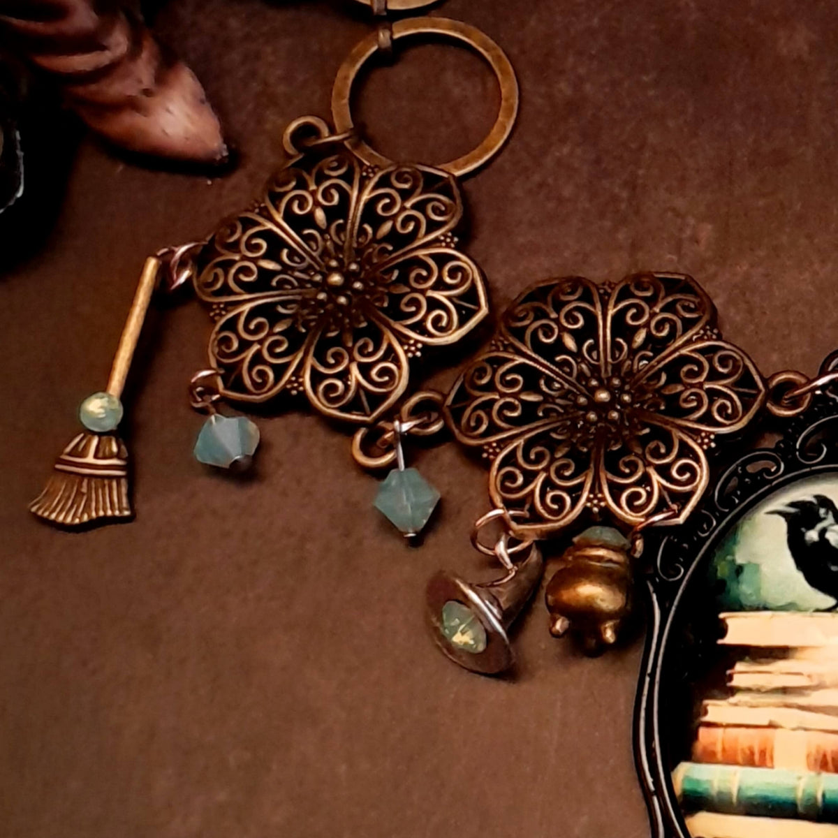 crow necklace fairytale motifs witch hat room cauldron spinning wheel key