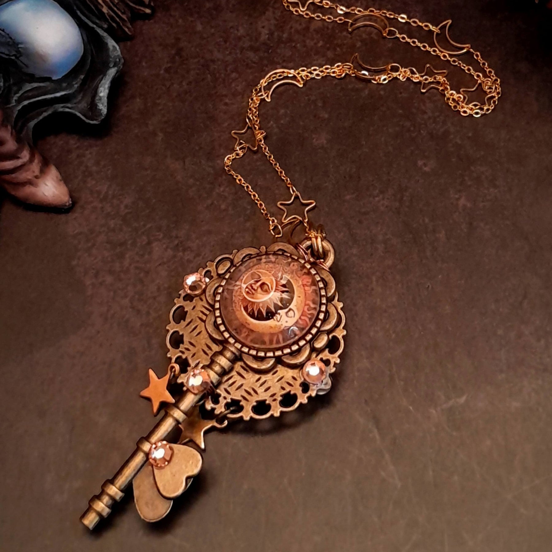 bohemian sun and moon cabochon necklace with stars and gold chain with stars and moons
