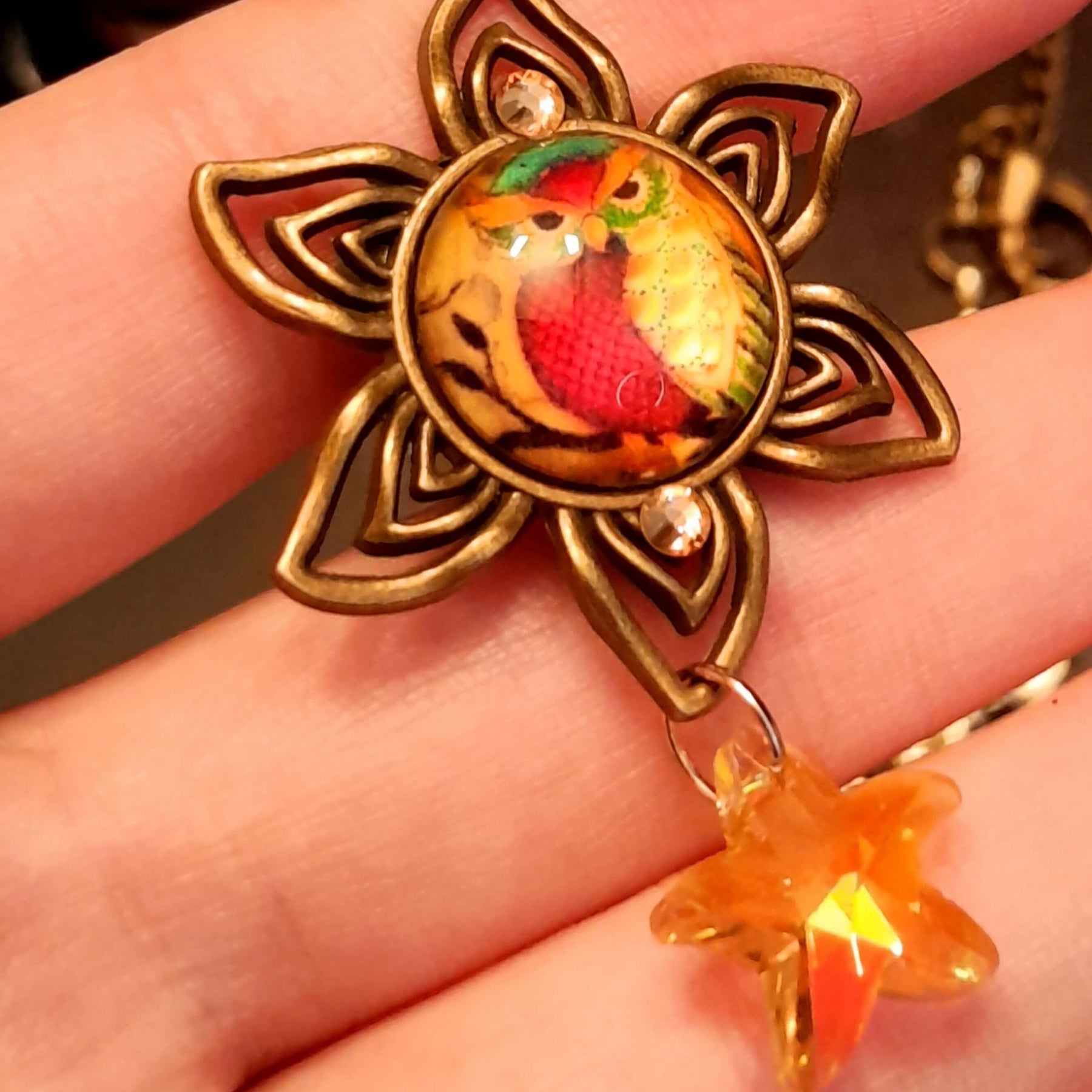 owl necklace with yellow star crystals and yellow brown tones floral settings for owl cabochons