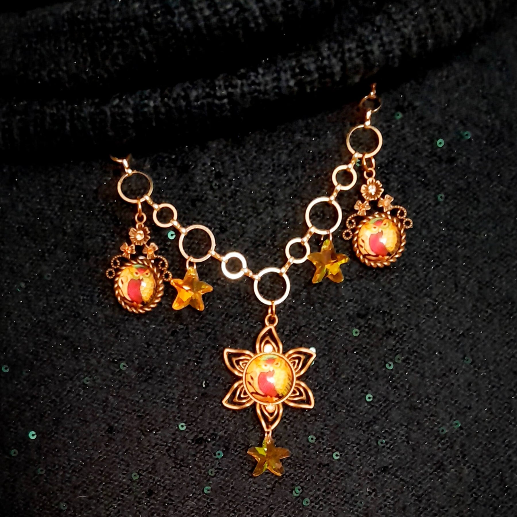 owl necklace with yellow star crystals and yellow brown tones floral settings for owl cabochons