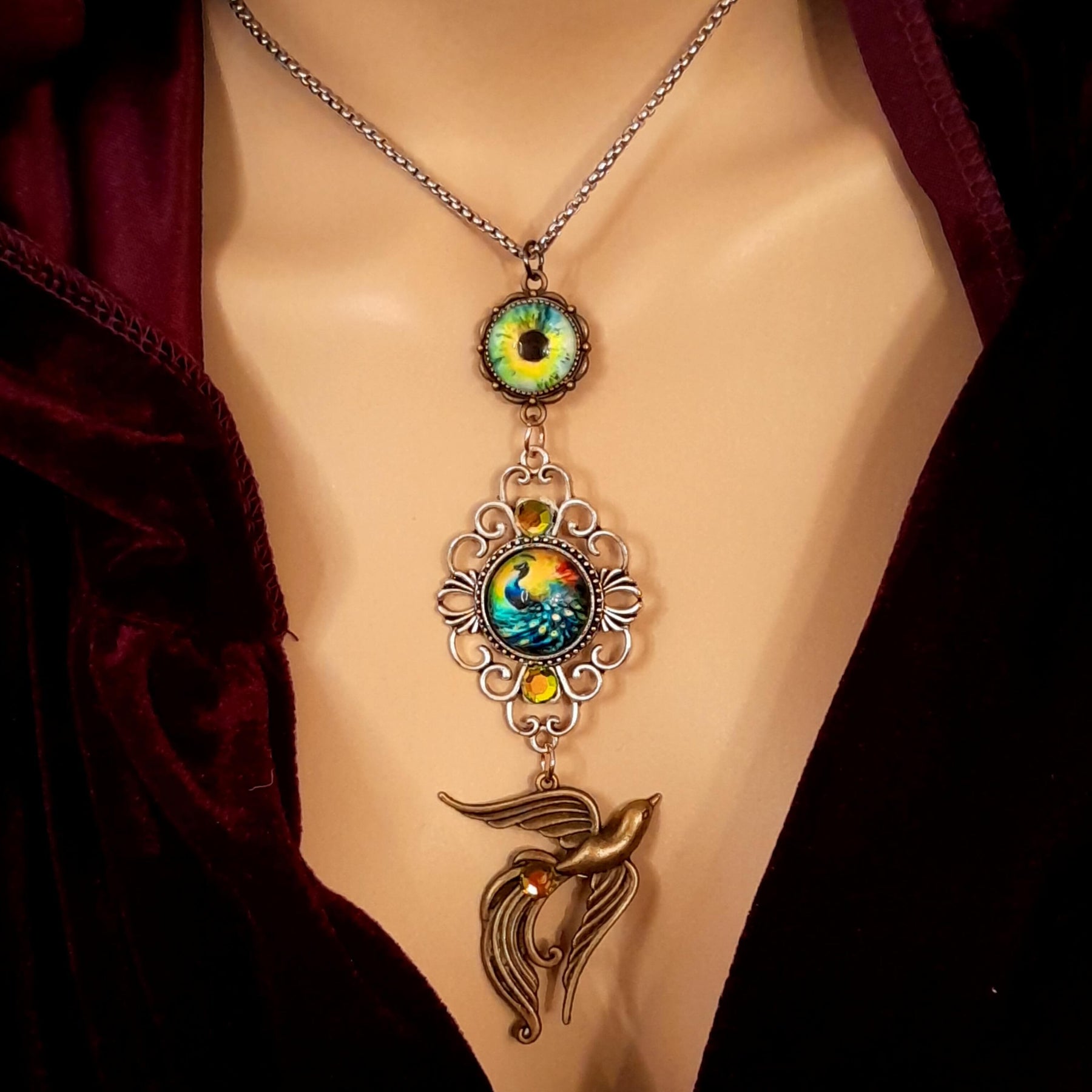 peacock cabochon peacock eye magical phoenix swarovski volcano and peridot crystals hidden fairies on the back