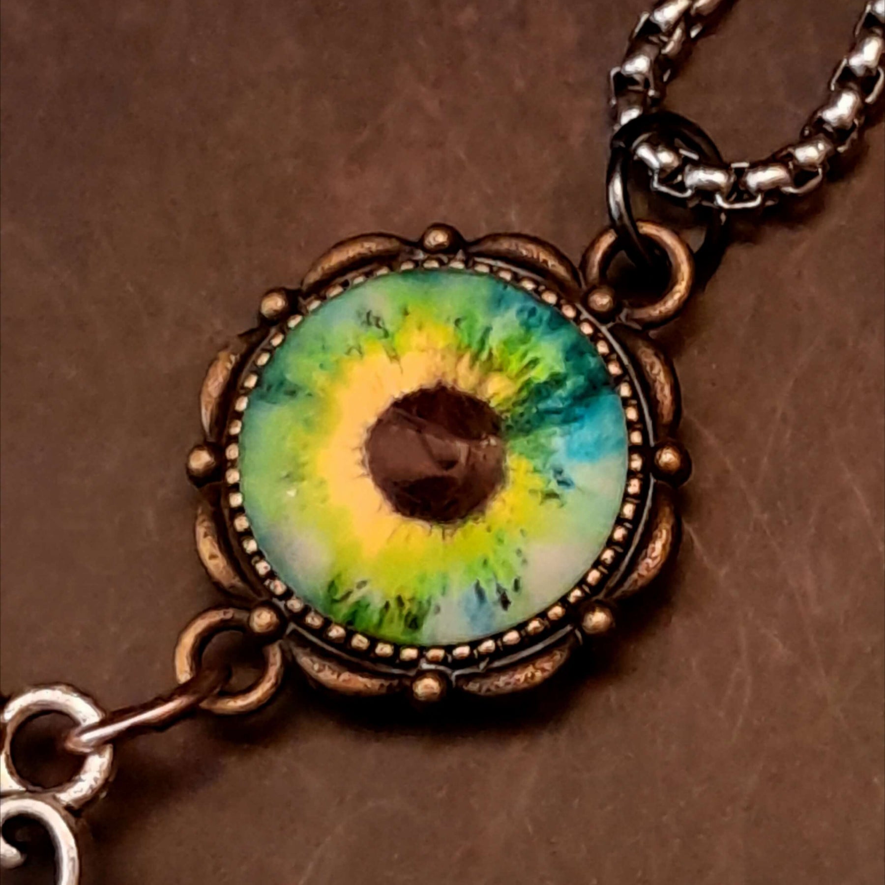 peacock cabochon peacock eye magical phoenix swarovski volcano and peridot crystals hidden fairies on the back