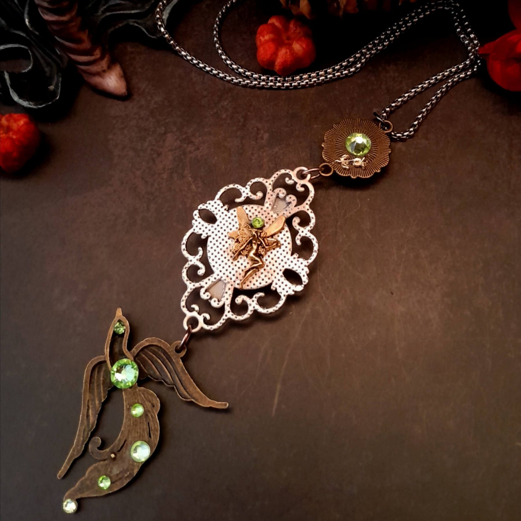 peacock cabochon peacock eye magical phoenix swarovski volcano and peridot crystals hidden fairies on the back