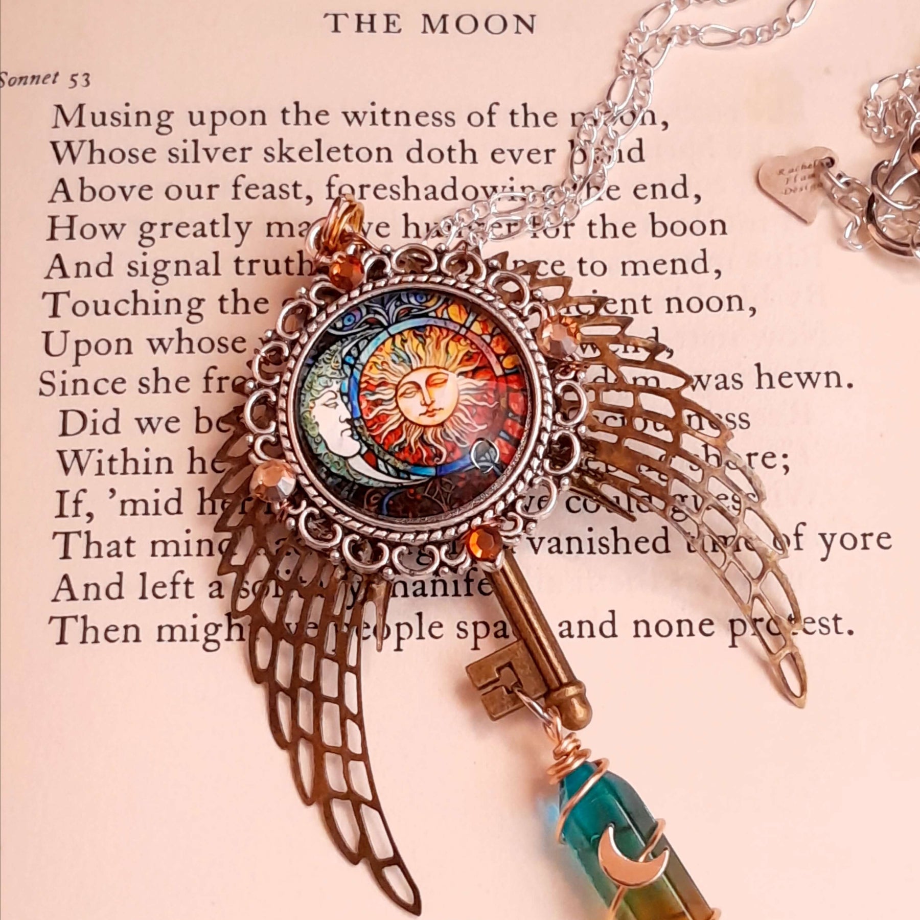 boho hippie sun and moon cabochon necklace glass icicle in pink yellow and green. angel wings swarovski crystals