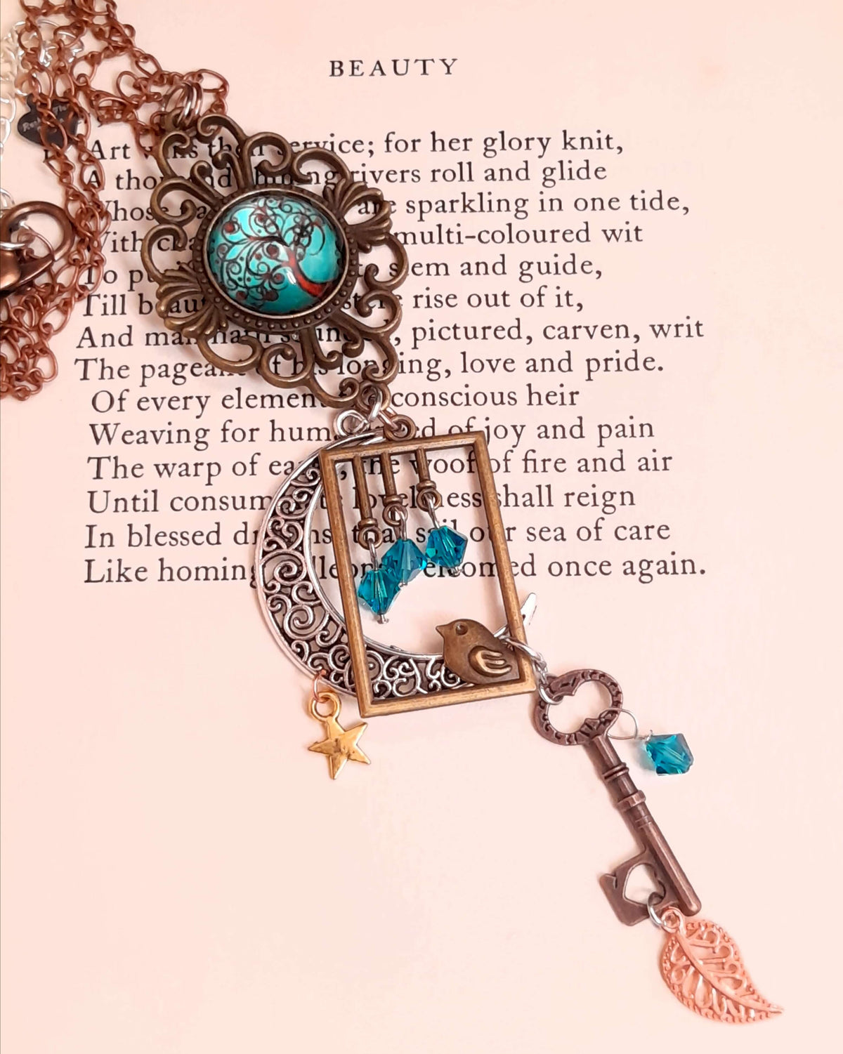 Victorian style bird necklace with tree of life cabochon, bird cage and bird, turquoise swarovski crystals silver filigree moon gold star and copper leaf.