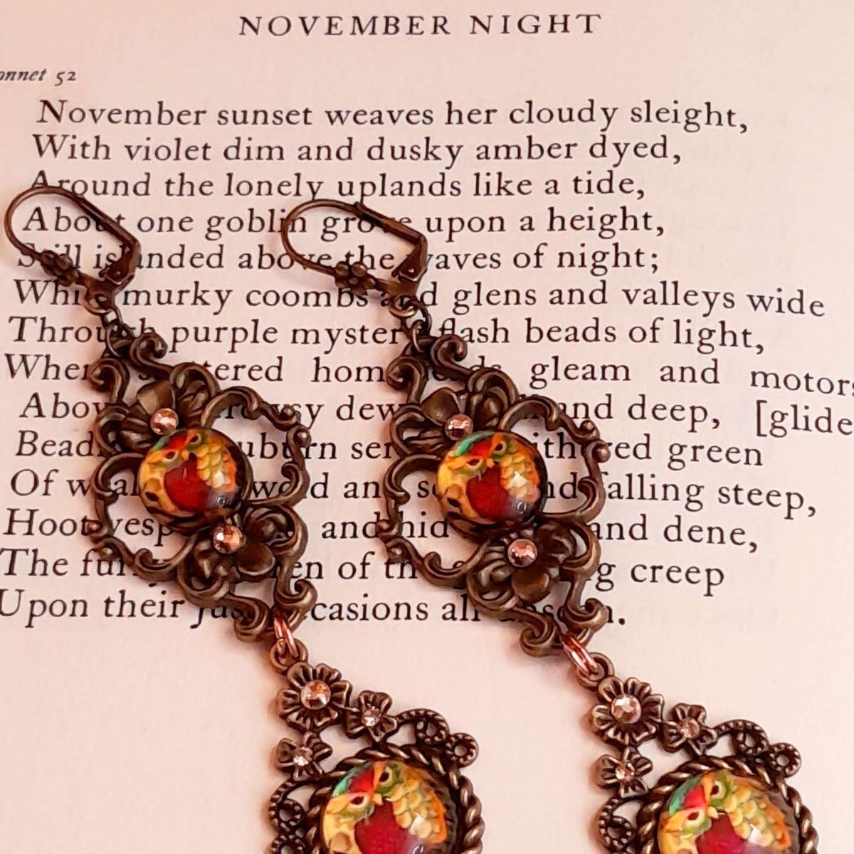 4 owl cabochons nesstled into victorian style brass settings. swarovski crystals