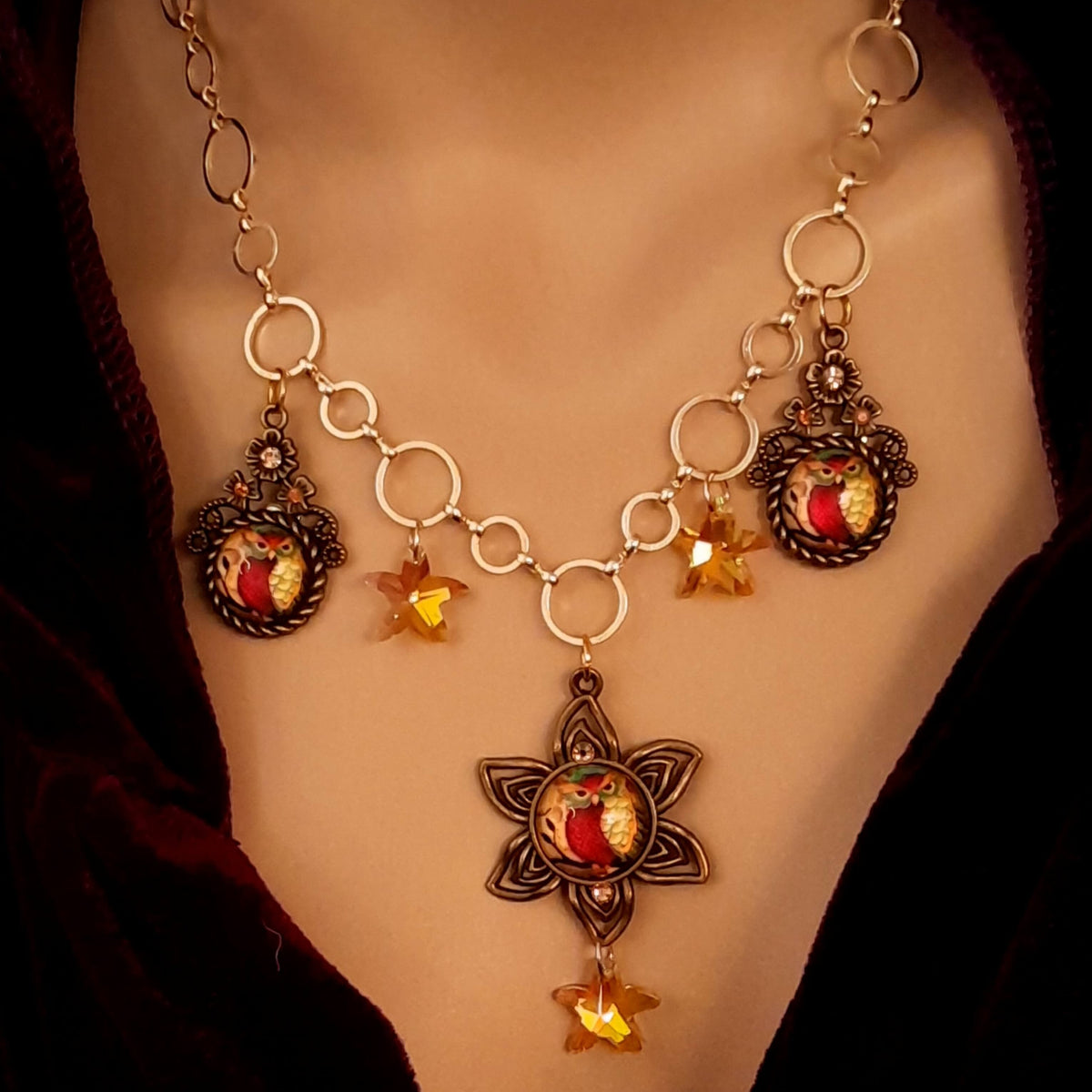 owl necklace with yellow star crystals and yellow brown tones floral settings for owl cabochons