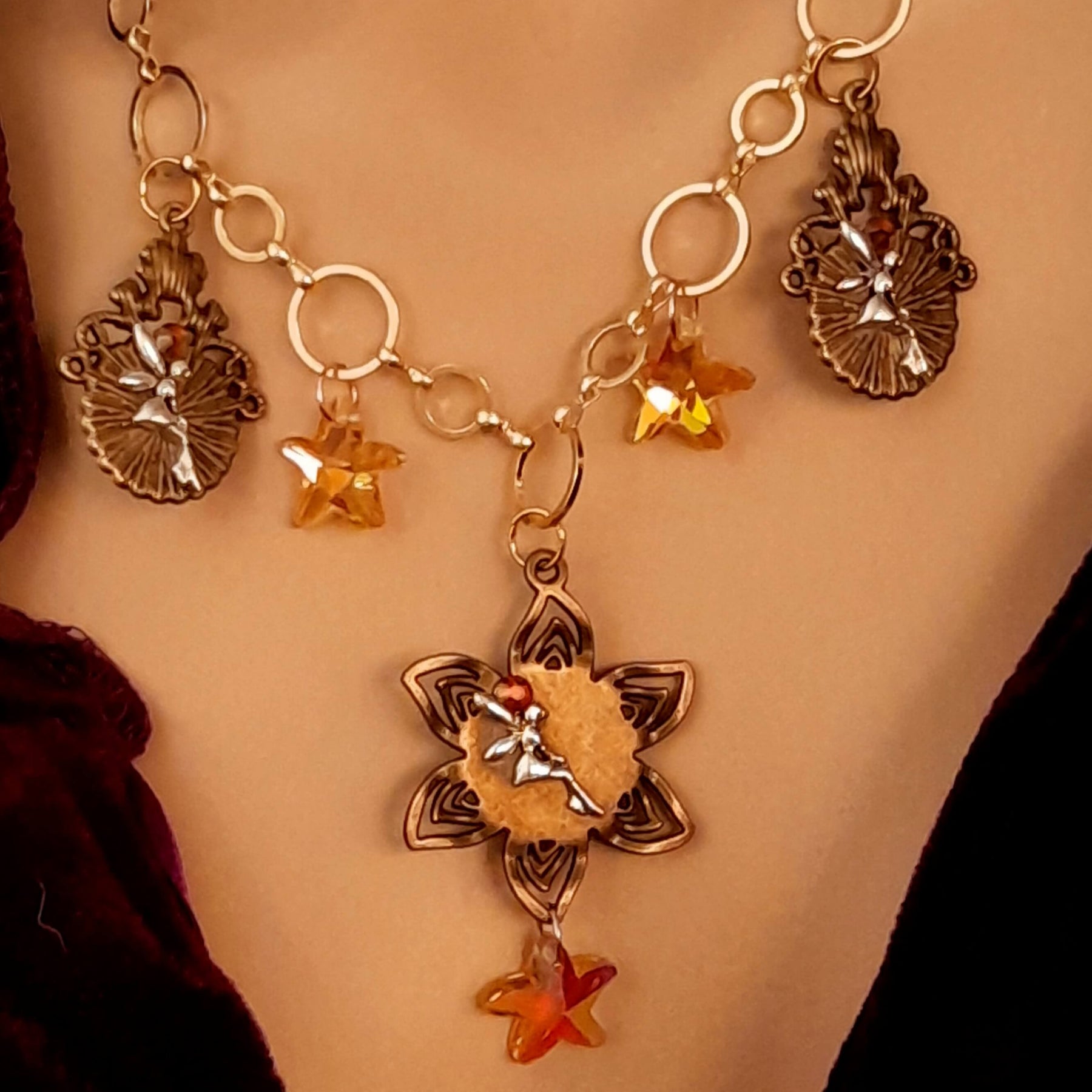 owl necklace with yellow star crystals and yellow brown tones floral settings for owl cabochons