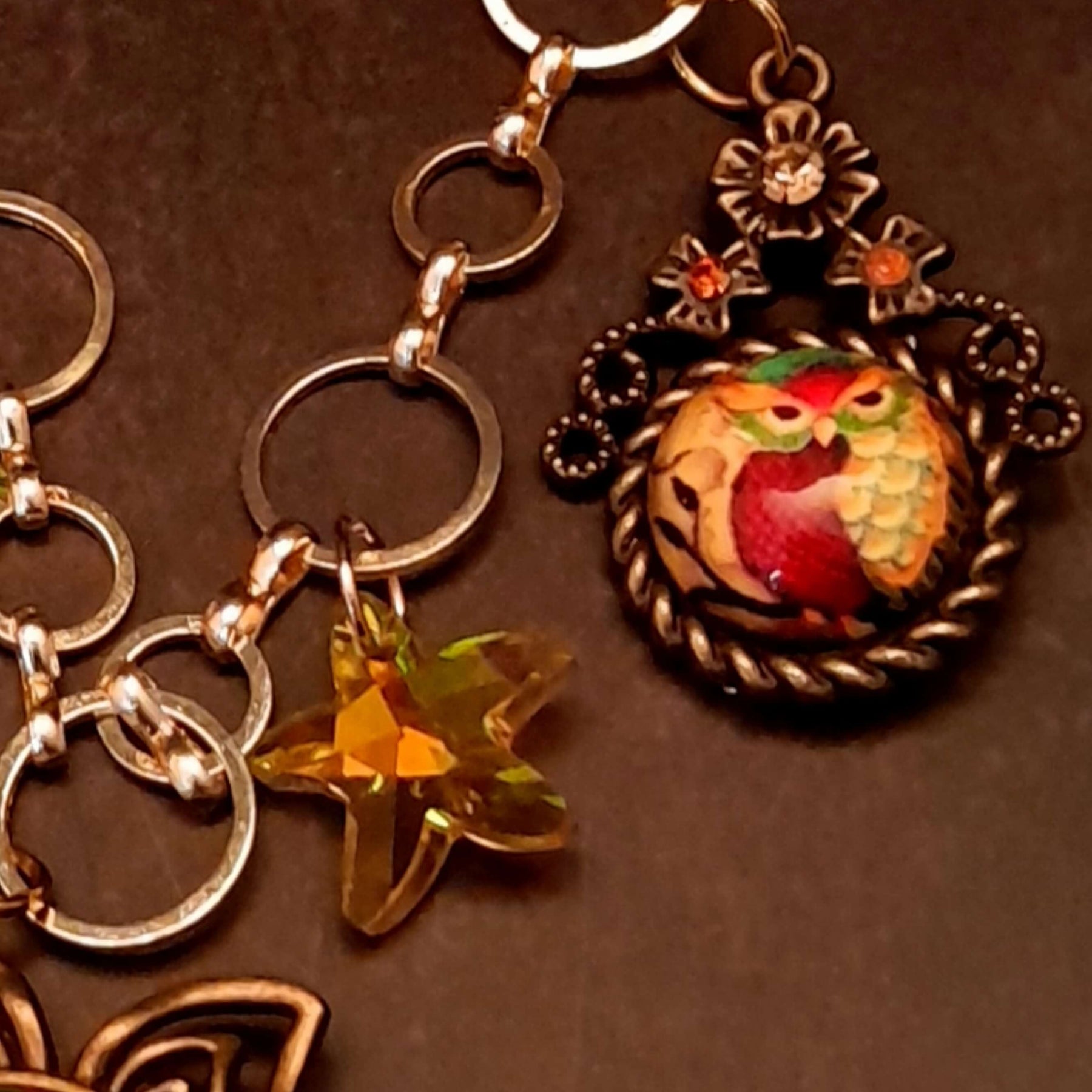 owl necklace with yellow star crystals and yellow brown tones floral settings for owl cabochons