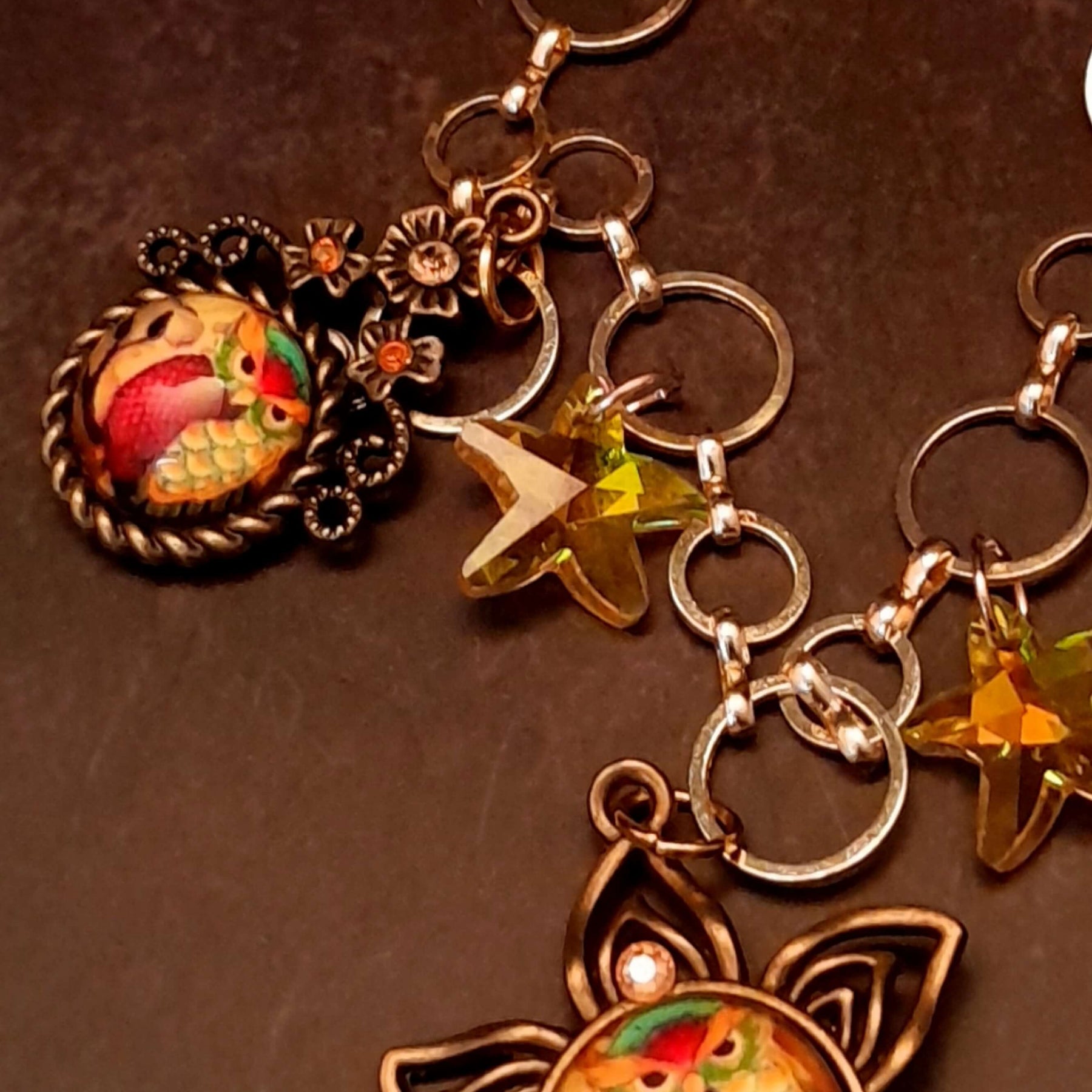 owl necklace with yellow star crystals and yellow brown tones floral settings for owl cabochons