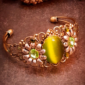 Handmade adjustable green cat’s-eye crystal bracelet with flowers and filigree, Victorian style vintage style fantasy jewelry featuring Swarovski crystals