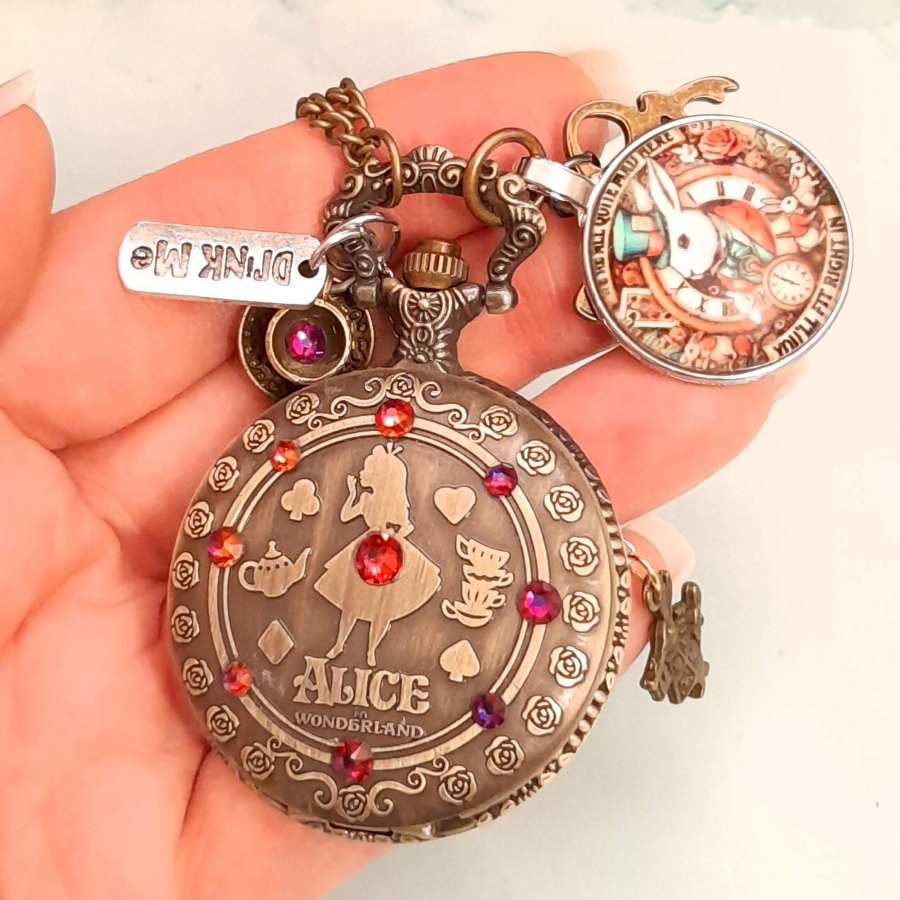 Alice in Wonderland pocket watch necklace back view with Drink Me tag and White Rabbit charm red Swarovski crystals antiqued brass Victorian style vintage style fantasy handmade