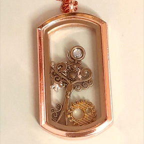 Handmaid Alice in Wonderland Openable Locket Necklace with three charms inside the locket gear key and white rabbit 