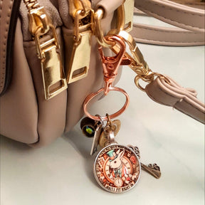 Alice in Wonderland magical fantasy purse charm clipped to zipper pull with White Rabbit clock face, teacup, ornate key, and Swarovski crystal charms — Victorian style vintage style