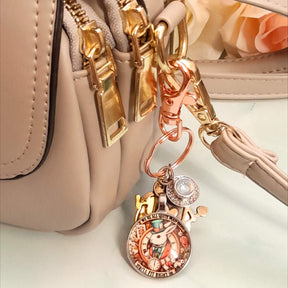 Handmade magical fantasy Alice in Wonderland purse charm clipped to handbag zipper with White Rabbit clock medallion, teacup and Queen of Hearts charms, Victorian style vintage style