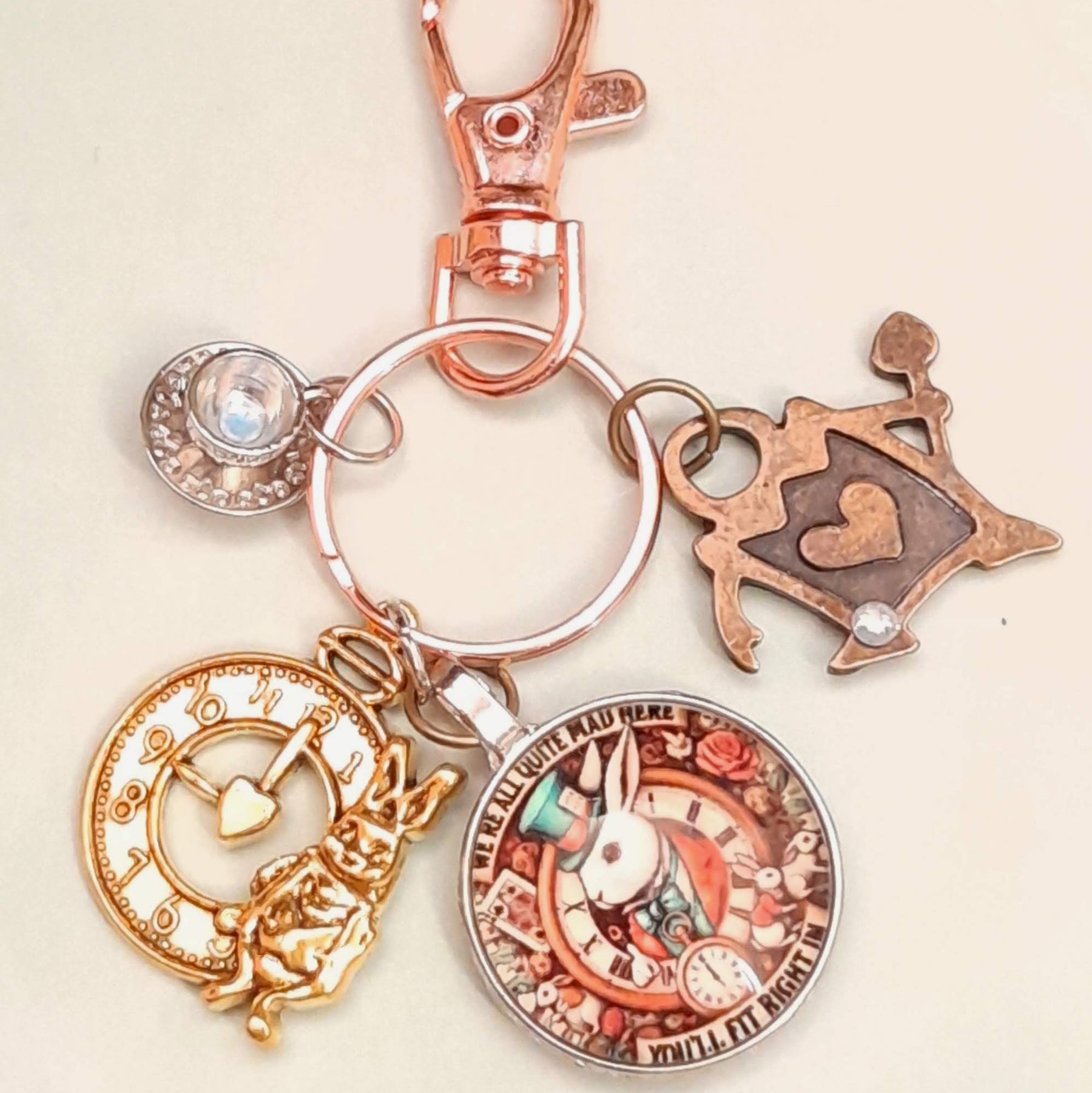 Alice in Wonderland handmade magical fantasy purse charm with White Rabbit clock face, teacup, and Queen of Hearts charms, Swarovski crystals, Victorian style vintage style