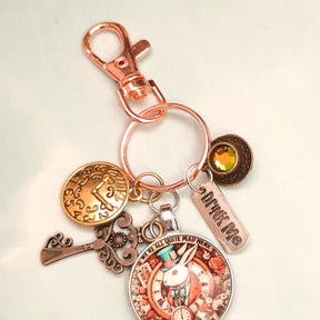 Alice in Wonderland magical fantasy purse charm with White Rabbit clock face, teacup, sun charm, ornate key, Swarovski crystal, and Vitrail Medium color-shifting crystal — Victorian style vintage style
