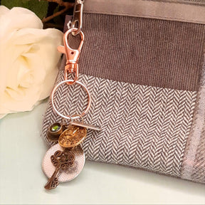 Alice in Wonderland magical fantasy purse charm clipped to zipper pull with White Rabbit clock face, ornate key, and Swarovski crystal — Victorian style vintage style