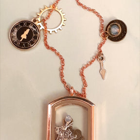 Handmade fantasy Alice in Wonderland openable locket necklace with White Rabbit inside, sun disc charm, gear and watch hand charms, Victorian style vintage style