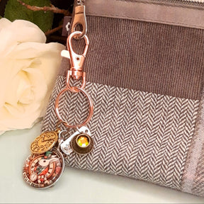 Alice in Wonderland fantasy purse charm and keychain with White Rabbit clock face cabochon, teacup charm, White Rabbit figurine, melting clock, and wristwatch charm — Victorian style vintage style