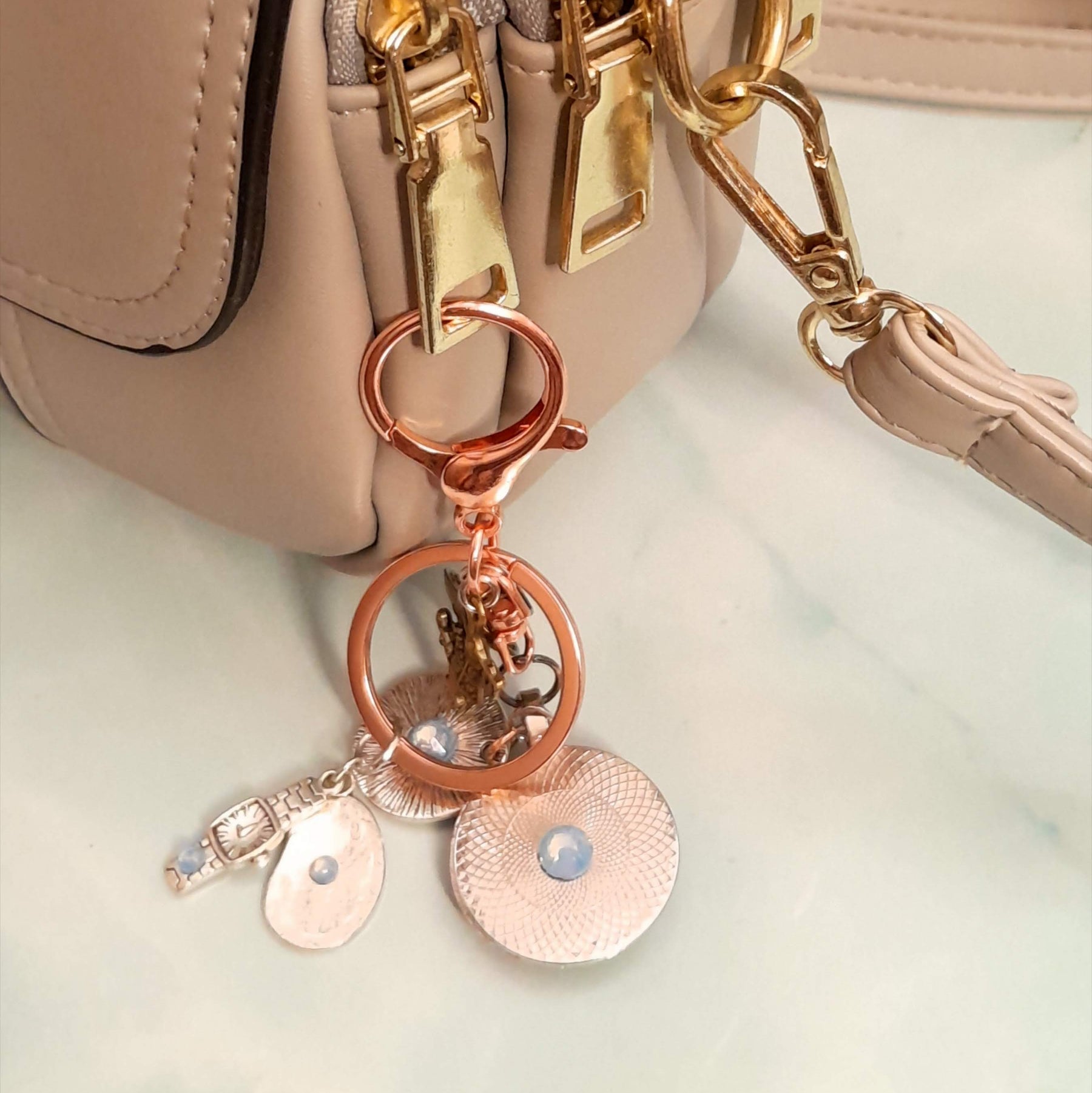 Alice in Wonderland fantasy purse charm and keychain clipped to zipper with White Rabbit clock face cabochon, round textured disc with yellow Swarovski crystal, and lobster clasp — Victorian style vintage style