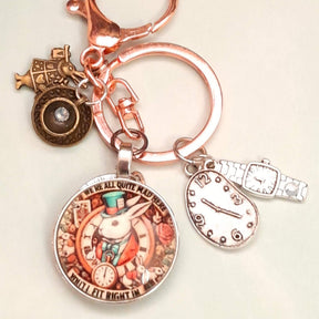 Alice in Wonderland fantasy purse charm and keychain clipped to zipper with round textured disc with Swarovski crystal, melting clock teardrop, wristwatch charm, and White Rabbit figurine — Victorian style vintage style