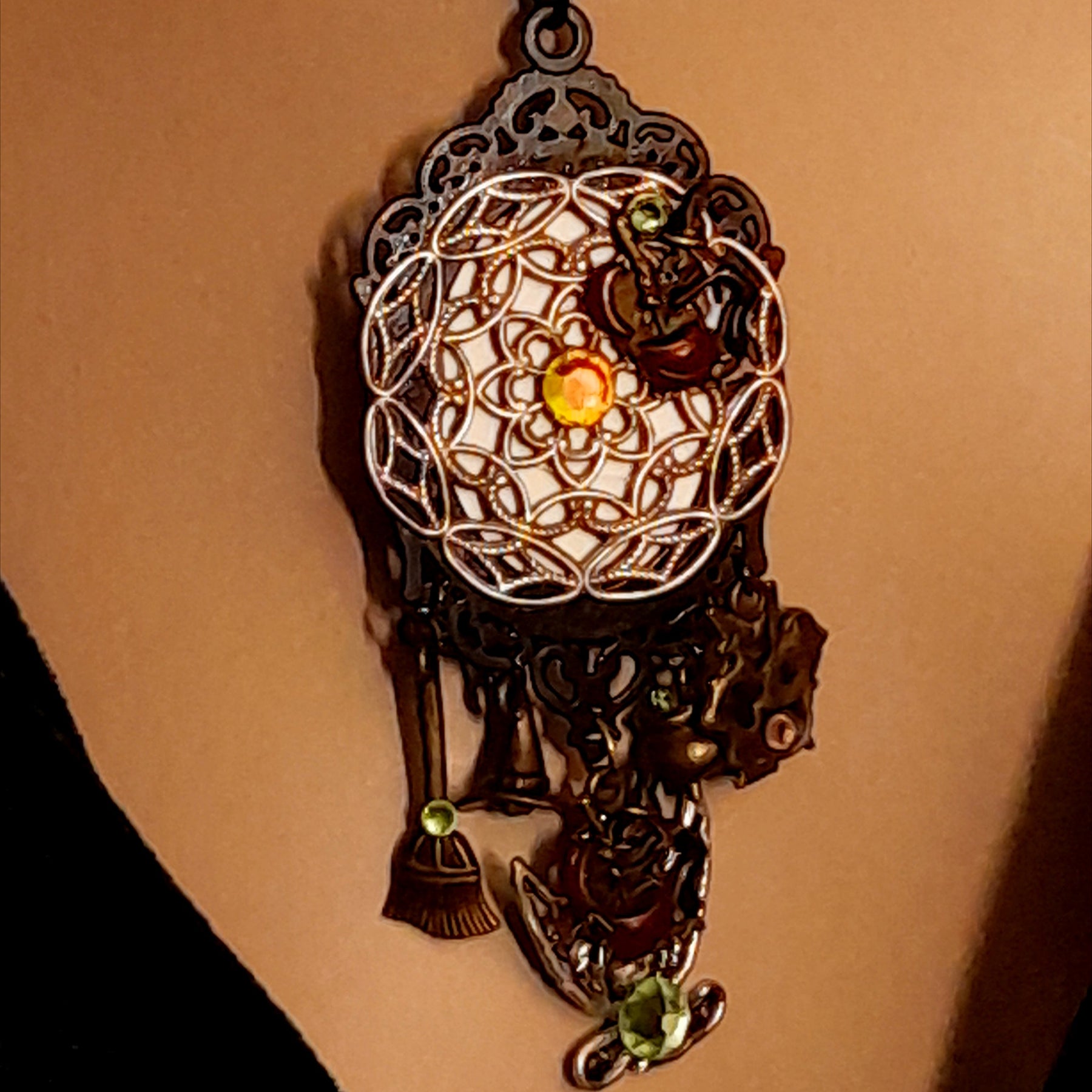 Victorian style vintage style witchy necklace with ornate enchanted castle pendant, mystical charms, amber and green Swarovski crystals, Rachel Flam Design