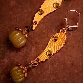 Victorian style vintage style angel wing drop earrings decorated with Swarovski Olivine crystals and finished with ribbed pumpkin dangles, detailed product photo by Rachel Flam Design