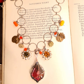 Halloween necklace with a large baroque Volcano Swarovski crystal shifting from pink to purple to a warm yellowish tone, nature-inspired flower details, Victorian style vintage style handmade jewelry