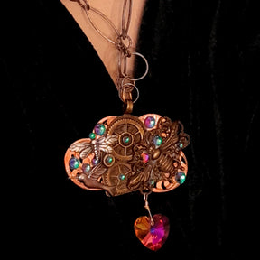 
Magical one-of-a-kind steampunk necklace with bee, hummingbird, dragonfly, and world-renowned genuine Swarovski multicolored crystal heart pendant

