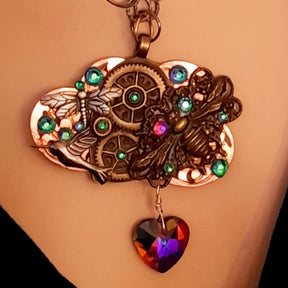 
Handmade magical steampunk fantasy necklace with bee, dragonfly, and hummingbird, world-renowned genuine Swarovski crystals, multicolored heart pendant

