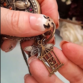 Handmade one of a kind fantasy pocket watch necklace with lovebirds, phoenix and butterfly charms, Swarovski crystals, Victorian style, vintage style, Rachel Flam Design