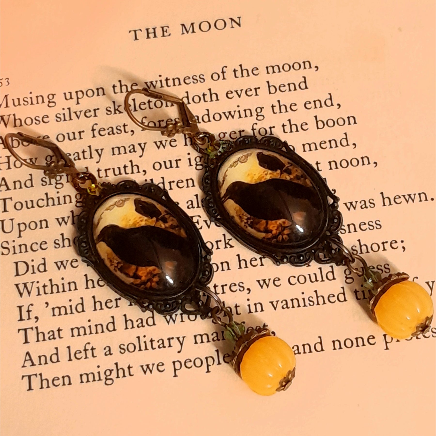Witchy crow earrings featuring dark birds, autumn woodland imagery, yellow cabochons, rounded pumpkin drops, and sparkling Swarovski crystals, Victorian style and vintage style fantasy jewelry by Rachel Flam Design