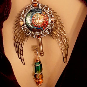 boho hippie sun and moon cabochon necklace glass icicle in pink yellow and green. angel wings swarovski crystals