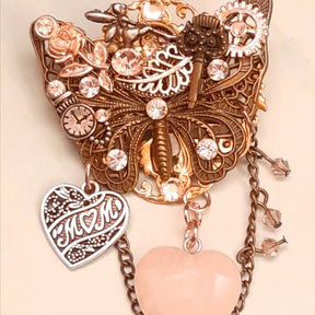 
Victorian style vintage style handmade butterfly brooch with rose quartz heart and world-renowned genuine Swarovski crystals — magical fantasy Mother's Day gift

