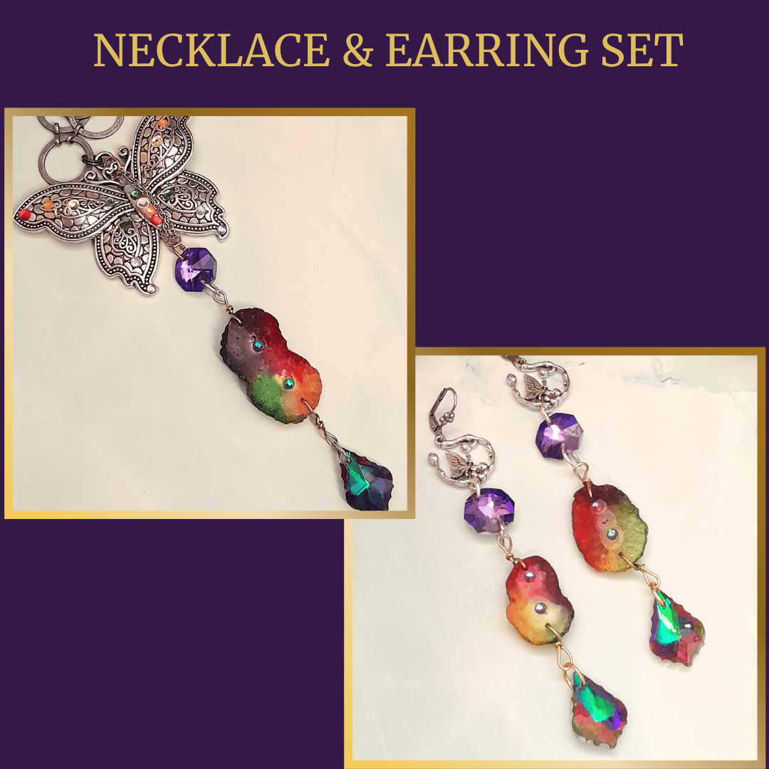 Stunning rainbow stones, butterfly necklace and long dangle earring set with volcano multi-color changing baroque crystals at the bottom, purple glass stones, handmade in New York, Rachel Flam design. 