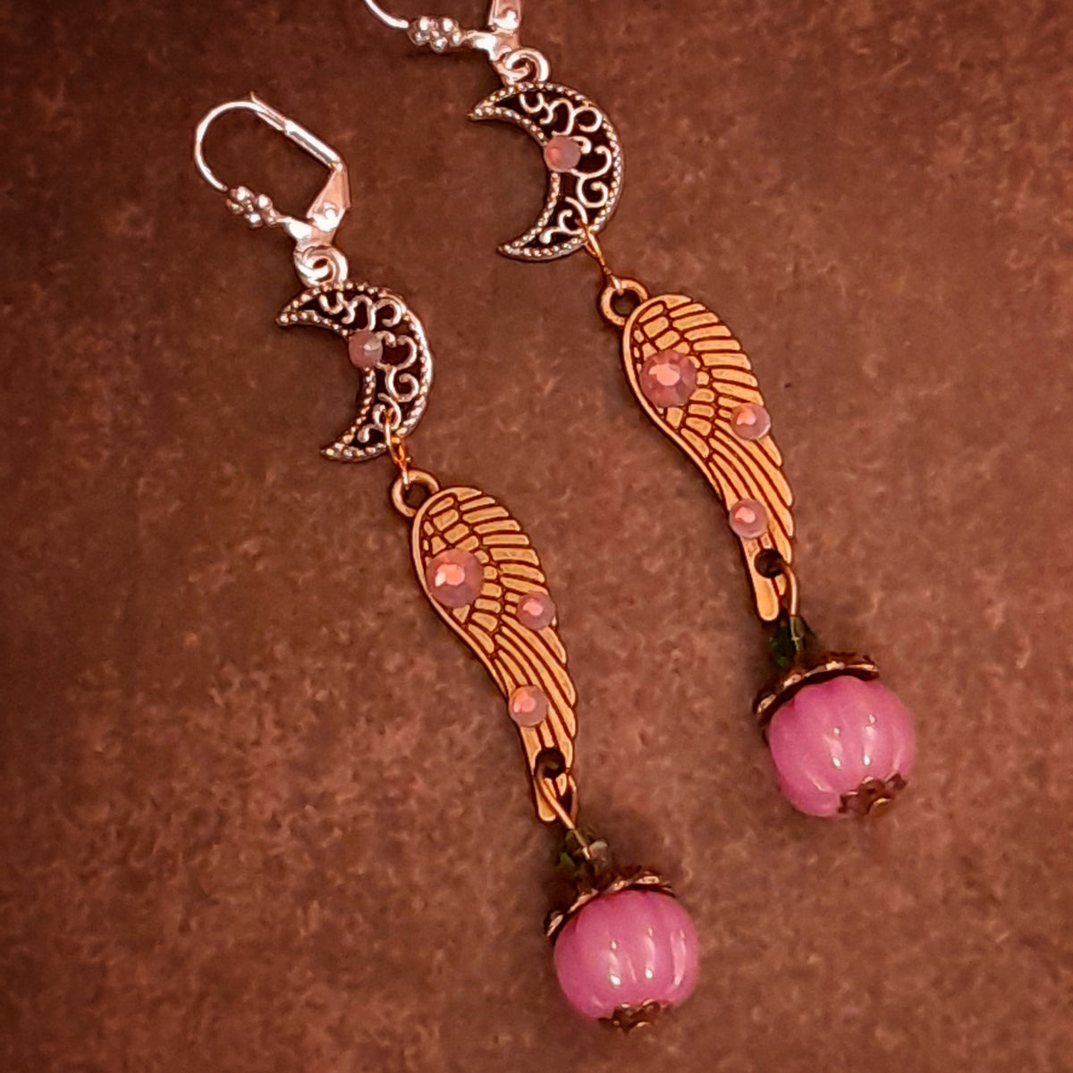 Handmade magical fantasy earrings featuring crescent moon charms, angel wings, lavender Swarovski crystals, and pumpkin drops, Victorian style vintage style jewelry
