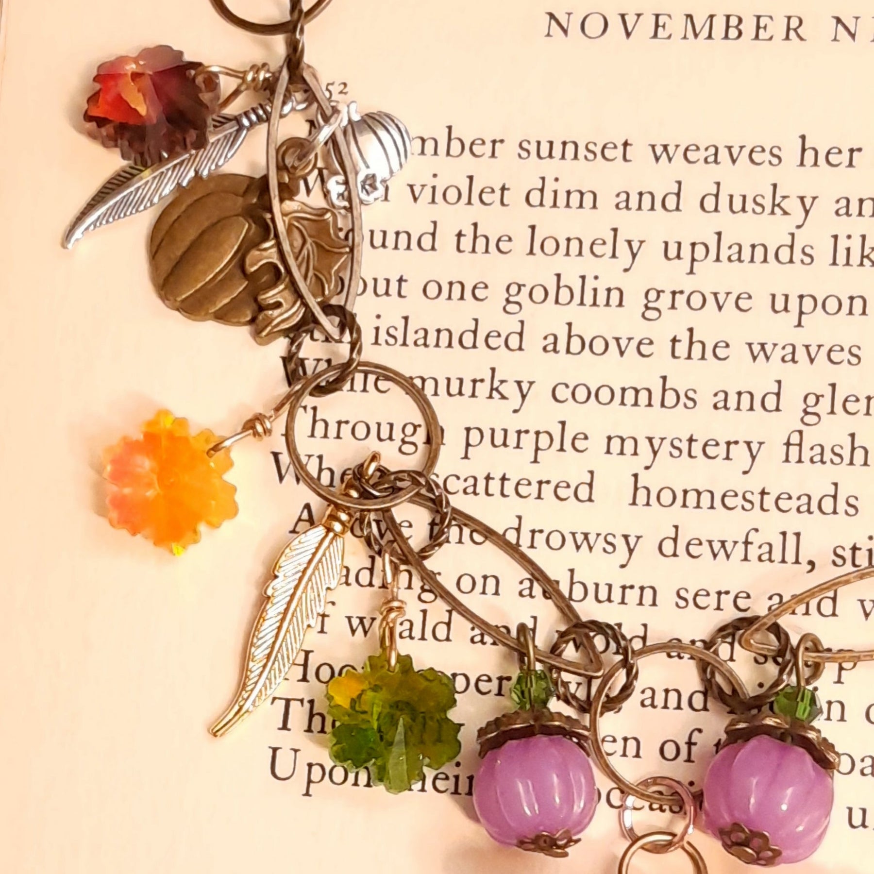 Colorful Swarovski crystals with pumpkins, feathers and leaves on a handmade magical Halloween necklace in Victorian style and vintage style by Rachel Flam Design