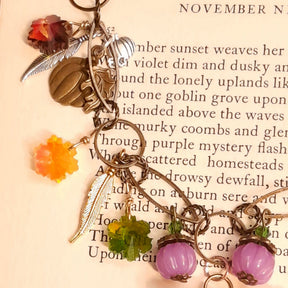 Colorful Swarovski crystals with pumpkins, feathers and leaves on a handmade magical Halloween necklace in Victorian style and vintage style by Rachel Flam Design