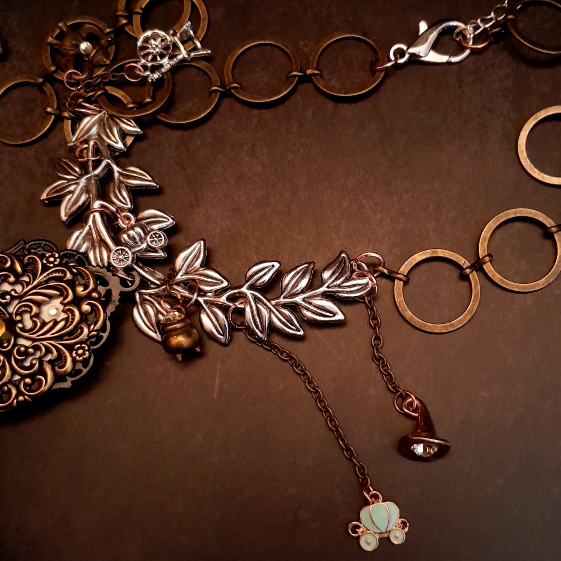 fairytale crow necklace witch hat spinning wheel cauldron mirror broom pumpkin carraige magic lamp