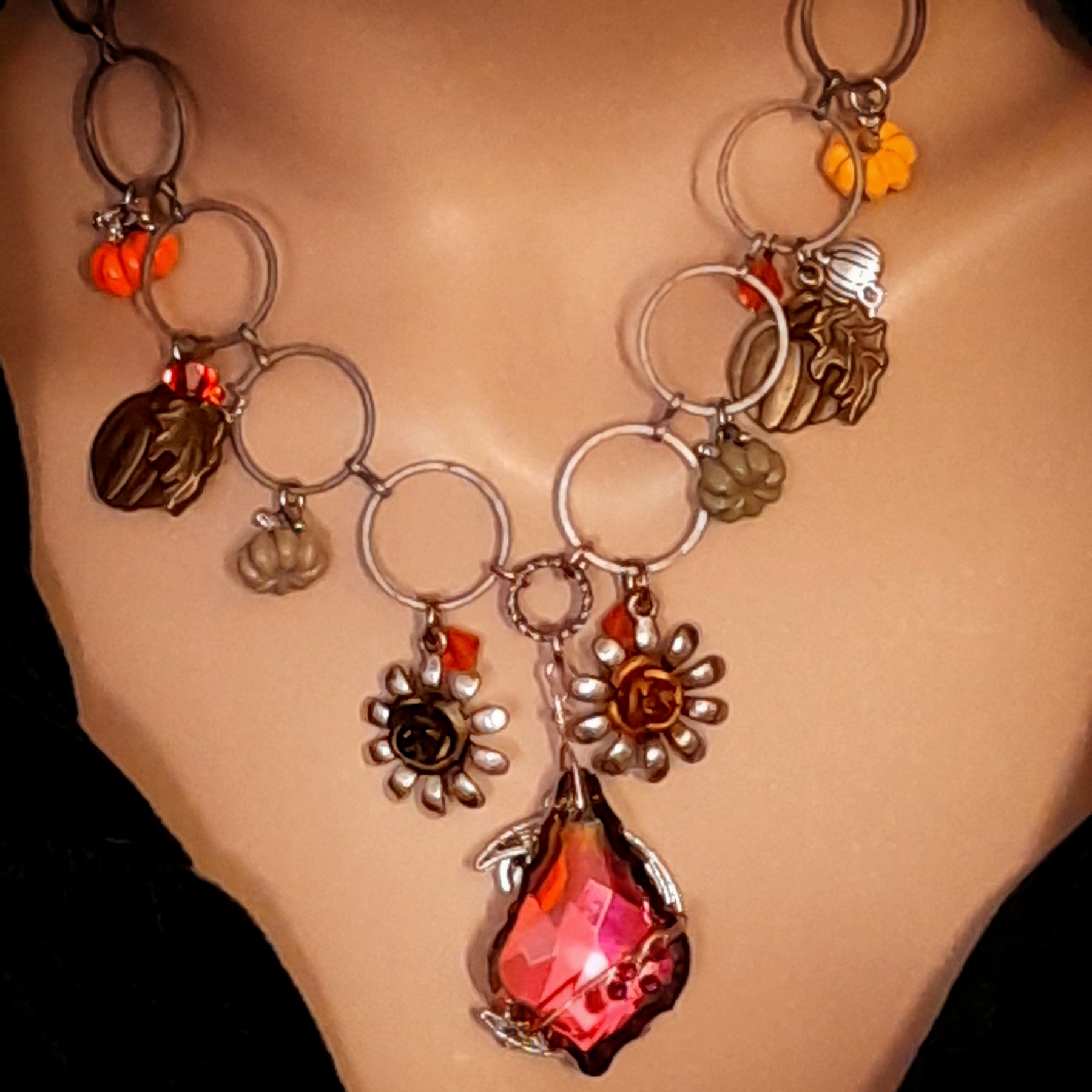 Handmade Halloween nature necklace with a large Volcano Swarovski crystal pendant, flower details, pumpkins, and layered crystal accents, Victorian style vintage style jewelry by Rachel Flam Design