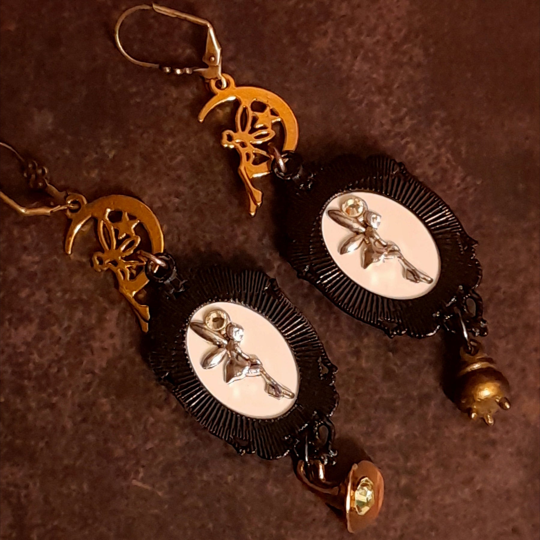 Halloween witchy fairy earrings showing decorative fairy details on the backs, crescent moons, raven imagery, a miniature cauldron, witch hat charm, and Swarovski crystals, Victorian style vintage style magical fantasy jewelry