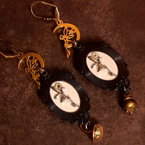 Halloween witchy fairy earrings showing decorative fairy details on the backs, crescent moons, raven imagery, a miniature cauldron, witch hat charm, and Swarovski crystals, Victorian style vintage style magical fantasy jewelry